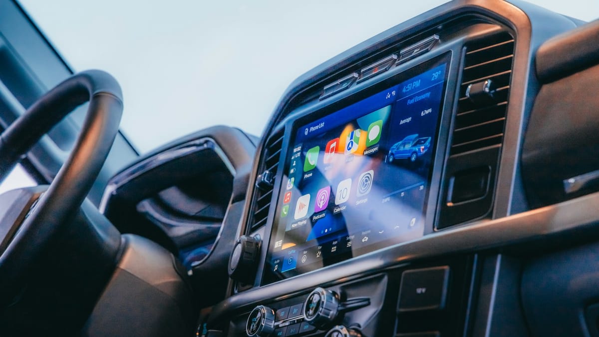 A modern car dashboard with a large infotainment touchscreen